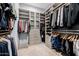 Organized walk-in closet with custom shelving and ample storage at 7482 S Mccormick Way, Queen Creek, AZ 85142