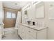 Bathroom features a double sink vanity with granite countertops and a shower-tub combo at 7729 E Catalina Dr, Scottsdale, AZ 85251