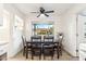 Inviting dining room with a modern ceiling fan and a large window for natural light at 7729 E Catalina Dr, Scottsdale, AZ 85251