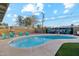 Backyard pool area featuring a refreshing swimming pool, lounge chairs, and vibrant mural at 7729 E Catalina Dr, Scottsdale, AZ 85251