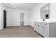 Modern bathroom featuring gray cabinets, gray vinyl floor, stylish lighting, and a sleek, minimalist design at 8220 N 35Th Ave, Phoenix, AZ 85051