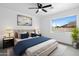 Inviting bedroom with a comfortable bed, soft lighting, and view of a pool outside the window at 8220 N 35Th Ave, Phoenix, AZ 85051