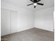 Bedroom featuring a ceiling fan, closet, and wood floors providing a modern, simple design at 8220 N 35Th Ave, Phoenix, AZ 85051