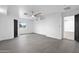 Living room with white walls, wood floor, ceiling fan, and views from window create a bright, airy atmosphere at 8220 N 35Th Ave, Phoenix, AZ 85051