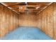 Interior view of an empty shed with wooden framing, concrete floor, and overhead lighting at 8220 N 35Th Ave, Phoenix, AZ 85051