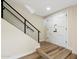 Inviting entryway featuring modern staircase and stylish double door entrance at 8377 E Indian School Rd, Scottsdale, AZ 85251