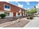 Charming townhomes with unique tiled roofs offer a delightful curb appeal and inviting desert landscaping at 8377 E Indian School Rd, Scottsdale, AZ 85251