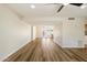 Spacious living room featuring sleek laminate wood flooring and a modern ceiling fan at 8377 E Indian School Rd, Scottsdale, AZ 85251