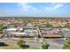 Aerial view showing the tennis courts, community pool, and the surrounding residential area at 8541 W Rosemonte Dr, Peoria, AZ 85382