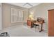 Bedroom featuring a shuttered window and desk area at 8541 W Rosemonte Dr, Peoria, AZ 85382