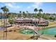 Bird's eye view of the clubhouse with a serene pond and bridge, and lush greenery at 8541 W Rosemonte Dr, Peoria, AZ 85382