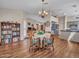 Open-concept dining area boasts wood-look laminate floors and a seamless flow to the kitchen at 8541 W Rosemonte Dr, Peoria, AZ 85382