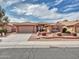 Charming single-story home features a two car garage and appealing low maintenance desert landscaping at 8541 W Rosemonte Dr, Peoria, AZ 85382