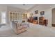 Bright living room with shuttered windows, comfortable seating, and a functional layout for a relaxed lifestyle at 8541 W Rosemonte Dr, Peoria, AZ 85382