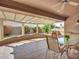 Covered patio area features a ceiling fan and views of the outdoor landscape at 8541 W Rosemonte Dr, Peoria, AZ 85382