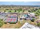 Aerial view featuring the clubhouse area, tennis courts, pool, and surrounding community at 8541 W Rosemonte Dr, Peoria, AZ 85382