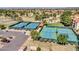 A high aerial view of the community tennis courts, featuring well-maintained courts and nearby parking at 8541 W Rosemonte Dr, Peoria, AZ 85382