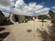 Spacious backyard featuring desert landscaping, mature trees and covered outdoor seating at 10 N Agua Fria Ln, Casa Grande, AZ 85194