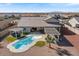 Aerial view of a beautiful house showcasing a pool and patio in the backyard at 10256 W Appaloosa Trl, Casa Grande, AZ 85194