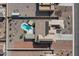 Overhead shot of a house featuring a pool, covered patios, and solar panels at 10256 W Appaloosa Trl, Casa Grande, AZ 85194