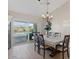 Dining area with views of a refreshing backyard pool through a sliding glass door at 10256 W Appaloosa Trl, Casa Grande, AZ 85194