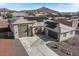 Stunning home featuring solar panels, a two-car garage, a paved driveway, and desert landscaping at 10256 W Appaloosa Trl, Casa Grande, AZ 85194