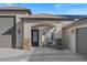 Inviting front entrance featuring a seating area and stylish architectural details at 10256 W Appaloosa Trl, Casa Grande, AZ 85194