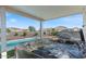 Close-up of hot tub under a covered patio, showcasing water features and landscaping at 10256 W Appaloosa Trl, Casa Grande, AZ 85194