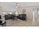 Spacious living room featuring high ceilings, wood floors, and stylish furnishings creating a comfortable ambiance at 10256 W Appaloosa Trl, Casa Grande, AZ 85194