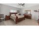 Comfortable main bedroom features neutral tones, tile flooring, and ample space for relaxation at 10256 W Appaloosa Trl, Casa Grande, AZ 85194