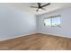 Bedroom with ceiling fan, flooring and neutral paint and a large window for great natural light at 10839 W Peoria Ave, Sun City, AZ 85351