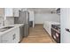 Bright and airy kitchen featuring white cabinetry, stainless steel appliances, and a marble countertop at 10839 W Peoria Ave, Sun City, AZ 85351