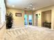 Expansive bedroom suite with neutral colors, a ceiling fan, and multiple entry doors at 1131 W Sierra Madre Ave, Gilbert, AZ 85233