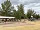 Neighborhood park with playground, swings, and shaded picnic area creating a fun, Gathering-friendly environment at 1131 W Sierra Madre Ave, Gilbert, AZ 85233