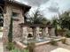 Stone water feature adds luxury and elegance to the community grounds at 1131 W Sierra Madre Ave, Gilbert, AZ 85233