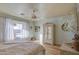 Bedroom with a ceiling fan, beige walls, and white cabinets at 1157 W Desert Lily Dr, San Tan Valley, AZ 85143