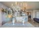 Spacious kitchen with a dining area, chandelier, and decorative vases on a table at 1157 W Desert Lily Dr, San Tan Valley, AZ 85143