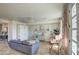 Living room featuring neutral walls and colorful floral curtains at 1157 W Desert Lily Dr, San Tan Valley, AZ 85143