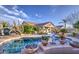 Stunning pool area with desert plants, cacti, and a view of the home, creating a private and inviting outdoor space at 1157 W Desert Lily Dr, San Tan Valley, AZ 85143