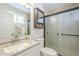 Bathroom features a vanity with granite countertop and glass-enclosed shower at 126 S Rita Ln, Chandler, AZ 85226