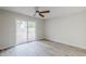 Bedroom features wood floors and sliding glass doors to a brick patio at 126 S Rita Ln, Chandler, AZ 85226