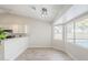 Bright dining area featuring views of the backyard, seamlessly connected to the kitchen at 126 S Rita Ln, Chandler, AZ 85226