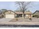 Single-story home with desert landscaping, featuring an attached garage and covered entry at 126 S Rita Ln, Chandler, AZ 85226