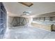 View of a garage with ample storage shelving at 126 S Rita Ln, Chandler, AZ 85226