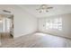 Inviting living area with hardwood floors, a large window, and neutral wall color at 126 S Rita Ln, Chandler, AZ 85226