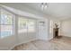 Bright living room featuring a brick fireplace and pool view at 126 S Rita Ln, Chandler, AZ 85226