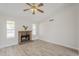 Cozy living room featuring a brick fireplace, hardwood floors, and natural light at 126 S Rita Ln, Chandler, AZ 85226