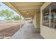 Spacious covered patio providing shade and relaxing backyard views at 126 S Rita Ln, Chandler, AZ 85226