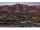 Wide aerial view of the neighborhood featuring scenic mountain views and desert landscaping at 12660 E Pivot Peak --, Gold Canyon, AZ 85118