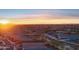 Aerial view of neighborhood featuring desert landscaping and beautiful sunset at 12660 E Pivot Peak --, Gold Canyon, AZ 85118